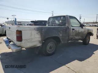 1989 Toyota Pickup z VIN JT4RN81R4K0003524, wystawiony jako Copart lot #56073845 z przebiegiem 153 704 mil mil oraz Tytuł czysty. Historia ofert i sprzedaży dostępna na DreamBid. Obrazek 3.