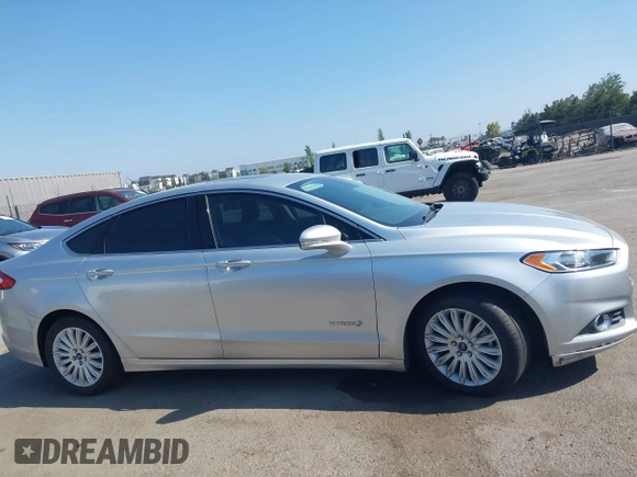 2016 Ford Fusion SE Hybrid z VIN 3FA6P0LU8GR203934, wystawiony jako IAAI lot #42595741 z przebiegiem 84 189 mil mil oraz . Historia ofert i sprzedaży dostępna na DreamBid. Obrazek 14.