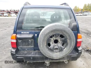 2004 Suzuki Vitara z VIN 2S3TD62VX46100019, wystawiony jako Copart lot #74291684 z przebiegiem 148 566 mil mil oraz Szkody całkowita. Historia ofert i sprzedaży dostępna na DreamBid. Obrazek 6.