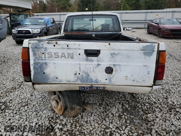 1990 Nissan Frontier with VIN 1N6SD16S9LC404281, listed as a Copart auction lot 84214904 with 279,270 mi miles and Salvage title. Bid and sale history available at DreamBid. Image 6.