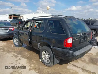 2001 Isuzu Rodeo S with VIN 4S2CK58W114363340, listed as a IAAI auction lot 41498698 with 185,408 mi miles and . Bid and sale history available at DreamBid. Image 3.