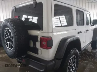 2024 Jeep Wrangler Rubicon with VIN 1C4PJXFG7RW334190, listed as a IAAI auction lot 42332948 with 14,272 mi miles and . Bid and sale history available at DreamBid. Image 4.