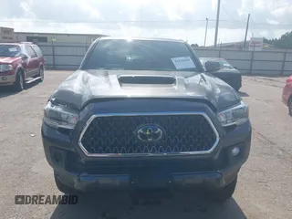 2018 Toyota Tacoma SR5 with VIN 3TMDZ5BN0JM051283, listed as a IAAI auction lot 42438690 with 106,155 mi miles and . Bid and sale history available at DreamBid. Image 12.