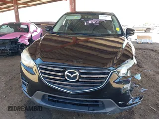 2016 Mazda CX-5 Sport with VIN JM3KE4BY8G0829002, listed as a IAAI auction lot 42553846 with 103,231 mi miles and . Bid and sale history available at DreamBid. Image 13.
