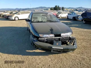 1996 Saturn SL z VIN 1G8ZK527XTZ335205, wystawiony jako Copart lot #42230735 z przebiegiem 82 344 mil mil oraz Szkoda całkowita • Salvage title. Historia ofert i sprzedaży dostępna na DreamBid. Obrazek 11.