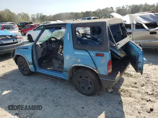 1995 Geo Tracker z VIN 2CNBE18UXS6930601, wystawiony jako Copart lot #76079094 z przebiegiem 276 136 mil mil oraz Szkody całkowita. Historia ofert i sprzedaży dostępna na DreamBid. Obrazek 2.