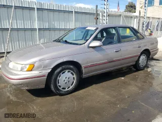 1995 Ford Taurus GL with VIN 1FALP5246SG150152, listed as a Copart auction lot 48558355 with 123,902 mi miles and Salvage Title. Bid and sale history available at carsss.com. Image 1.