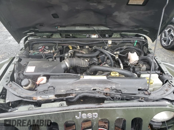 2007 Jeep Wrangler Unlimited Sahara с VIN 1J4GA59107L141710, выставлен на аукционе Copart как лот 59939755 с пробегом 212 659 миль миль и Списание • Salvage title. История ставок и продаж доступна на DreamBid. Изображение 12.