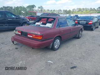 1991 Toyota Camry DLX z VIN 4T1SV21E0MU347371, wystawiony jako IAAI lot #42048695 z przebiegiem 209 451 mil mil oraz . Historia ofert i sprzedaży dostępna na DreamBid. Obrazek 4.