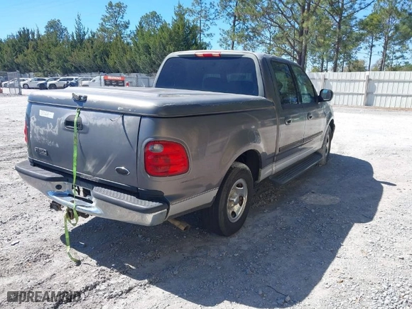 2002 Ford F-150 XLT with VIN 1FTRW07642KC65138, listed as a IAAI auction lot 41739516 with 354,140 mi miles. Bid and sale history available at carsss.com. Image 4.