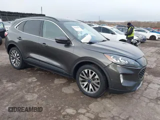 2020 Ford Escape Titanium Hybrid z VIN 1FMCU9DZ2LUB92948, wystawiony jako IAAI lot #41886609 z przebiegiem Nie podano mil oraz . Historia ofert i sprzedaży dostępna na DreamBid. Obrazek 1.