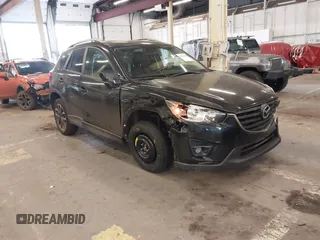 2016 Mazda CX-5 Grand Touring z VIN JM3KE4DY3G0760605, wystawiony jako IAAI lot #42149408 z przebiegiem 65 692 mil mil oraz . Historia ofert i sprzedaży dostępna na DreamBid. Obrazek 1.