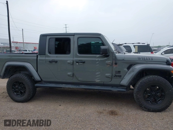 2022 Jeep Gladiator Texas Trail z VIN 1C6HJTAG2NL176011, wystawiony jako IAAI lot #42193864 z przebiegiem 27 219 mil mil oraz . Historia ofert i sprzedaży dostępna na DreamBid. Obrazek 14.