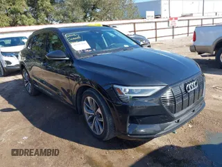 2021 Audi e-tron Premium Plus with VIN WA1LAAGE4MB010570, listed as a IAAI auction lot 41398464 with 67,721 mi miles. Bid and sale history available at carsss.com. Image 1.