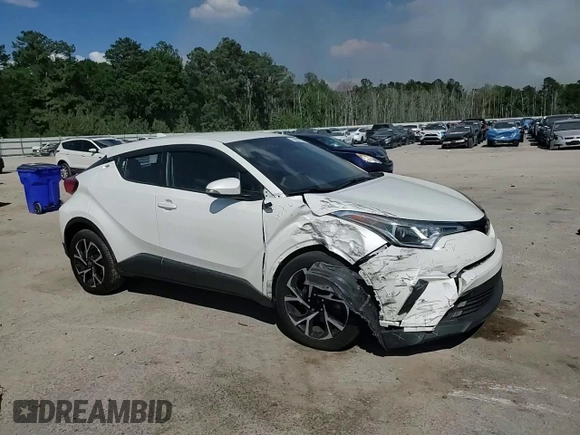 2018 Toyota C-HR XLE z VIN NMTKHMBX4JR031512, wystawiony jako Copart lot #55096715 z przebiegiem 100 522 mil mil oraz Szkoda całkowita • Salvage title. Historia ofert i sprzedaży dostępna na DreamBid. Obrazek 14.