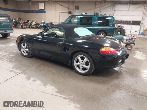 1999 Porsche Boxster z VIN WP0CA2984XU622814, wystawiony jako IAAI lot #42234977 z przebiegiem 52 404 mil mil oraz . Historia ofert i sprzedaży dostępna na DreamBid. Obrazek 3.