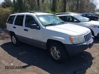 2004 Jeep Grand Cherokee Laredo with VIN 1J4GW48S54C314056, listed as a IAAI auction lot 42096065 with 164,113 mi miles. Bid and sale history available at carsss.com. Image 1.