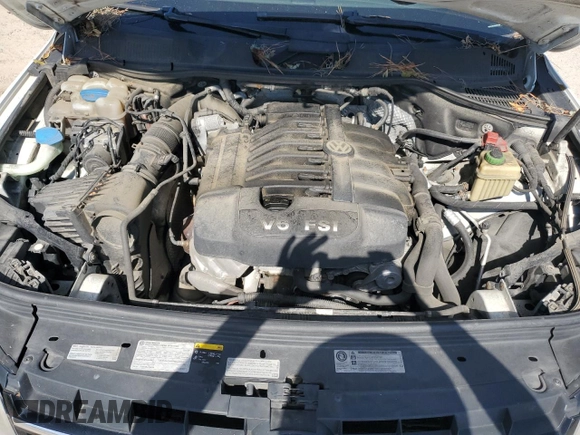 2014 Volkswagen Touareg Lux z VIN WVGEF9BP4ED011436, wystawiony jako Copart lot #74207144 z przebiegiem 207 059 mil mil oraz Szkoda całkowita • Salvage title. Historia ofert i sprzedaży dostępna na DreamBid. Obrazek 14.