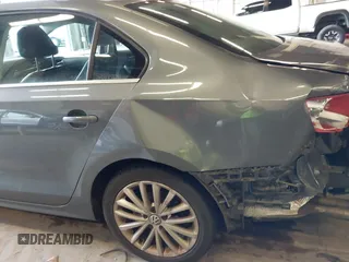 2014 Volkswagen Jetta SEL z VIN 3VWL17AJ8EM388218, wystawiony jako IAAI lot #41862353 z przebiegiem 140 514 mil mil oraz . Historia ofert i sprzedaży dostępna na DreamBid. Obrazek 12.