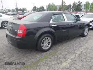 2009 Chrysler 300 LX with VIN 2C3KA43D19H506753, listed as a IAAI auction lot 42053199 with 106,092 mi miles. Bid and sale history available at carsss.com. Image 4.