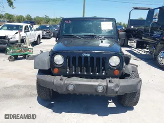 2013 Jeep Wrangler Unlimited Sport with VIN 1C4BJWDG7DL583686, listed as a IAAI auction lot 42037650 with 122,408 mi miles. Bid and sale history available at carsss.com. Image 13.