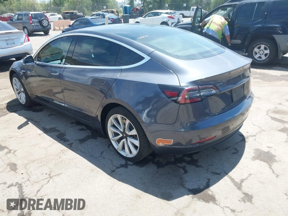 2020 Tesla Model 3 Standard Range Plus with VIN 5YJ3E1EAXLF615781, listed as a IAAI auction lot 42068935 with 96,026 mi miles. Bid and sale history available at carsss.com. Image 3.