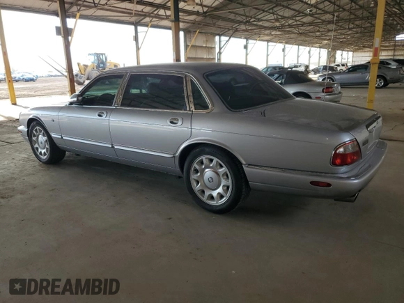 2000 Jaguar XJ with VIN SAJDA25B8YMF04079, listed as a Copart auction lot 50592595 with 131,647 mi miles and Salvage title. Bid and sale history available at DreamBid. Image 2.