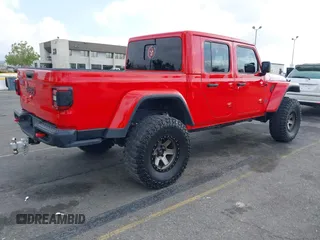 2021 Jeep Gladiator Rubicon with VIN 1C6JJTBGXML572976, listed as a IAAI auction lot 42134909 with 35,612 mi miles and . Bid and sale history available at DreamBid. Image 4.