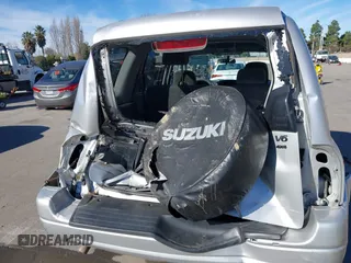 2003 Suzuki XL7 Touring z VIN JS3TX92V734114162, wystawiony jako IAAI lot #41250622 z przebiegiem 227 494 mil mil oraz . Historia ofert i sprzedaży dostępna na DreamBid. Obrazek 6.