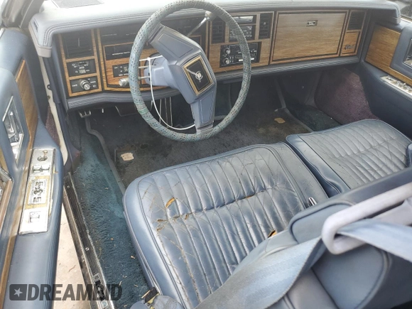1984 Cadillac Eldorado z VIN 1G6AL5783EE654296, wystawiony jako Copart lot #74945374 z przebiegiem 37 040 mil mil oraz Szkoda całkowita • Salvage title. Historia ofert i sprzedaży dostępna na DreamBid. Obrazek 8.
