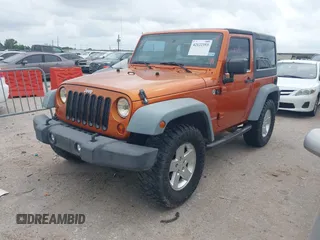 2011 Jeep Wrangler Sport with VIN 1J4AA2D1XBL579882, listed as a IAAI auction lot 42122353 with 153,885 mi miles and . Bid and sale history available at carsss.com. Image 17.
