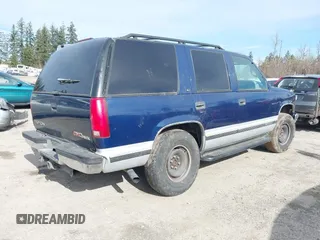 1997 GMC Yukon with VIN 1GKEK13R8VJ737324, listed as a IAAI auction lot 41675479 with 237,223 mi miles. Bid and sale history available at carsss.com. Image 4.