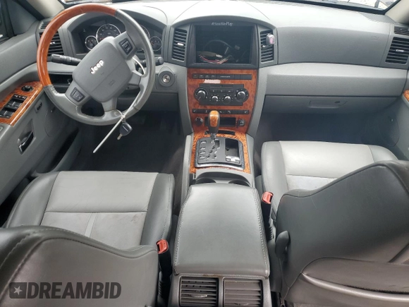 2007 Jeep Grand Cherokee Overland with VIN 1J8HR68227C651830, listed as a Copart auction lot 62403725 with 147,827 mi miles and Salvage title. Bid and sale history available at DreamBid. Image 8.