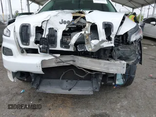 2015 Jeep Cherokee Latitude with VIN 1C4PJLCB5FW642701, listed as a IAAI auction lot 42063262 with 142,501 mi miles and . Bid and sale history available at carsss.com. Image 6.