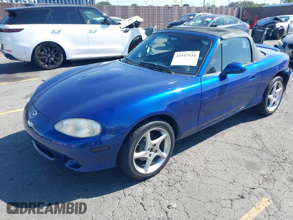 2003 Mazda MX-5 Miata Cloth z VIN JM1NB353830301964, wystawiony jako IAAI lot #42317534 z przebiegiem 192 342 mil mil oraz . Historia ofert i sprzedaży dostępna na DreamBid. Obrazek 17.