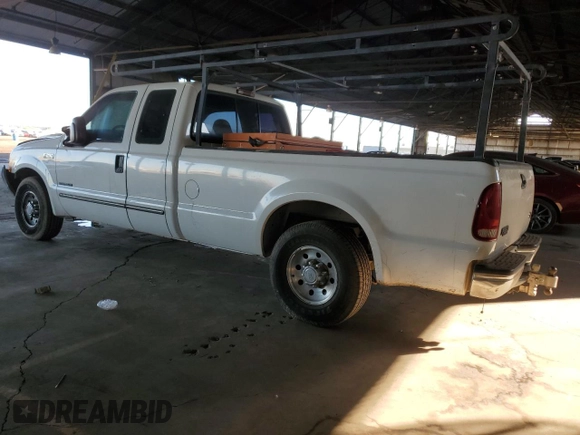 1999 Ford F-250 XL with VIN 1FTNX20FXXEE59499, listed as a Copart auction lot 87511735 with 215,520 mi miles and Salvage title. Bid and sale history available at DreamBid. Image 2.