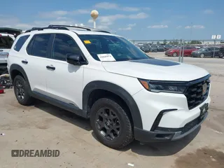 2023 Honda Pilot TrailSport z VIN 5FNYG1H67PB043095, wystawiony jako IAAI lot #42045974 z przebiegiem 46 333 mil mil oraz . Historia ofert i sprzedaży dostępna na DreamBid. Obrazek 1.