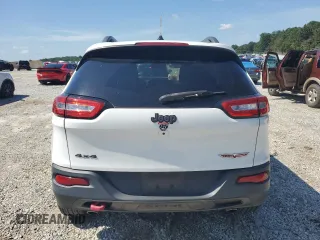 2015 Jeep Cherokee Trailhawk with VIN 1C4PJMBS0FW705288, listed as a Copart auction lot 61796275 with 133,874 mi miles and Salvage title. Bid and sale history available at DreamBid. Image 6.