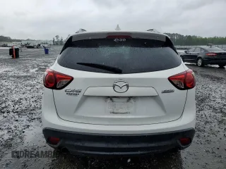 2016 Mazda CX-5 Touring z VIN JM3KE2CY5G0849288, wystawiony jako Copart lot #54594545 z przebiegiem 90 882 mil mil oraz Szkoda całkowita • Salvage title. Historia ofert i sprzedaży dostępna na DreamBid. Obrazek 6.
