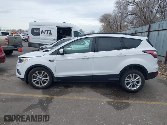 2018 Ford Escape SE z VIN 1FMCU9GD0JUC62783, wystawiony jako IAAI lot #41488153 z przebiegiem 55 774 mil mil oraz . Historia ofert i sprzedaży dostępna na DreamBid. Obrazek 14.