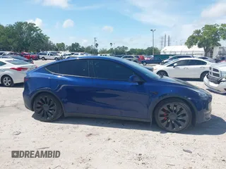 2023 Tesla Model Y Performance with VIN 7SAYGDEF9PF582908, listed as a IAAI auction lot 41930957 with 52,857 mi miles and . Bid and sale history available at DreamBid. Image 12.