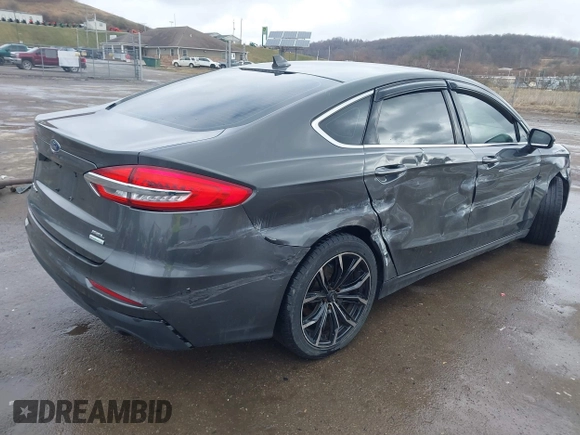 2019 Ford Fusion SEL with VIN 3FA6P0CD6KR141832, listed as a IAAI auction lot 41800102 with 142,282 mi miles and . Bid and sale history available at DreamBid. Image 4.