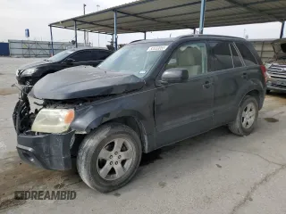 2009 Suzuki Grand Vitara z VIN JS3TE044094100649, wystawiony jako Copart lot #52033855 z przebiegiem 137 460 mil mil oraz Szkoda całkowita • Salvage title. Historia ofert i sprzedaży dostępna na DreamBid. Obrazek 1.