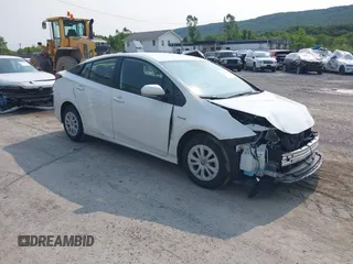 2021 Toyota Prius L Eco z VIN JTDKAMFU7M3147668, wystawiony jako IAAI lot #42390394 z przebiegiem 80 831 mil mil oraz . Historia ofert i sprzedaży dostępna na DreamBid. Obrazek 1.