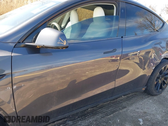 2023 Tesla Model Y Long Range with VIN 7SAYGDEE2PF883687, listed as a IAAI auction lot 41589837 with 36,890 mi miles. Bid and sale history available at carsss.com. Image 20.