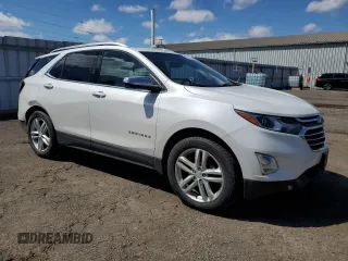 2021 Chevrolet Equinox Premier z VIN 2GNAXXEV6M6137669, wystawiony jako Copart lot #53437745 z przebiegiem 93 812 mil mil oraz Szkoda całkowita • Salvage title. Historia ofert i sprzedaży dostępna na DreamBid. Obrazek 4.