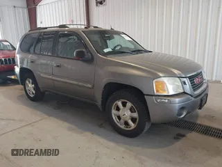 2005 GMC Envoy SLE z VIN 1GKDT13S252285747, wystawiony jako IAAI lot #42340642 z przebiegiem Nie podano mil oraz . Historia ofert i sprzedaży dostępna na DreamBid. Obrazek 1.