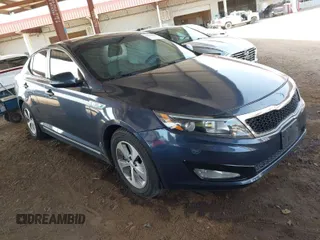 2015 Kia Optima Hybrid with VIN KNAGM4AD1F5079764, listed as a IAAI auction lot 41926228 with 104,824 mi miles. Bid and sale history available at carsss.com. Image 1.