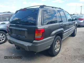 1999 Jeep Grand Cherokee Laredo with VIN 1J4GW58S2XC524365, listed as a IAAI auction lot 42432625 with 284,942 mi miles and . Bid and sale history available at DreamBid. Image 4.