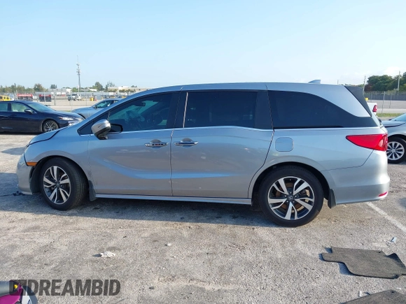 2023 Honda Odyssey Touring with VIN 5FNRL6H86PB020700, listed as a IAAI auction lot 41961098 with 66,512 mi miles and . Bid and sale history available at DreamBid. Image 14.